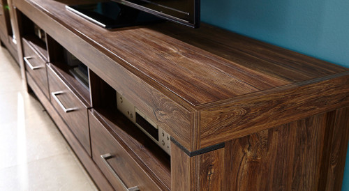 На фото вид сбоку тумбы ТВ GENT RTV3S/6/20 BRW дуб стирлинг в интерьере